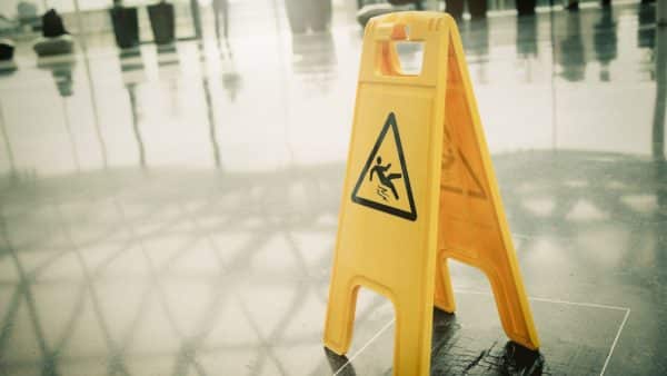 A yellow wet floor sign.