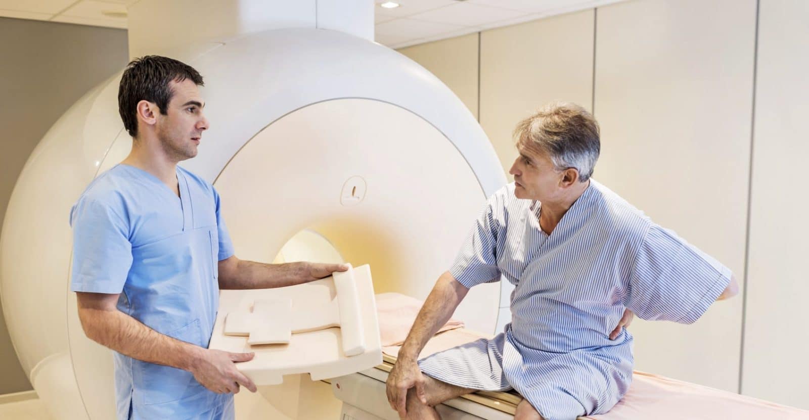 Injured Man Receiving Full Body X-ray Stock Photo