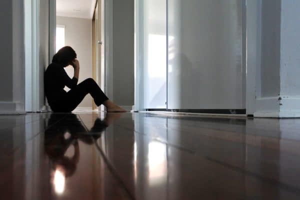 A woman feeling depressed after a car accident.